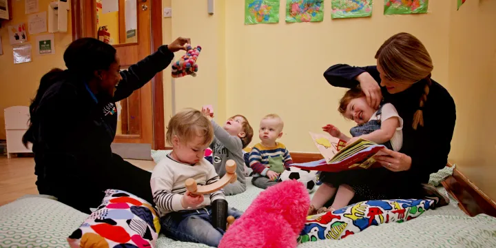 Cocoon Childcare staff playing with children