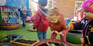 Cocoon Childcare - Children playing in the garden