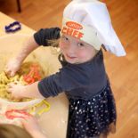 Cocoon Childcare - Child play cooking