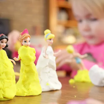 Cocoon Childcare Girl playing with Playdoh