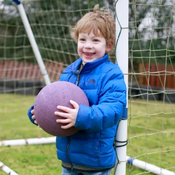 Cocoon Childcare Boy Playing Football